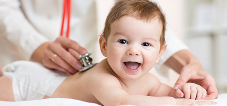 A pediatrician examines an infant, focusing on growth and development.